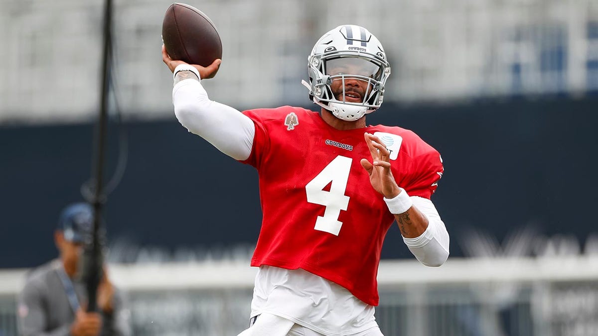 Dak Prescott throws at training camp