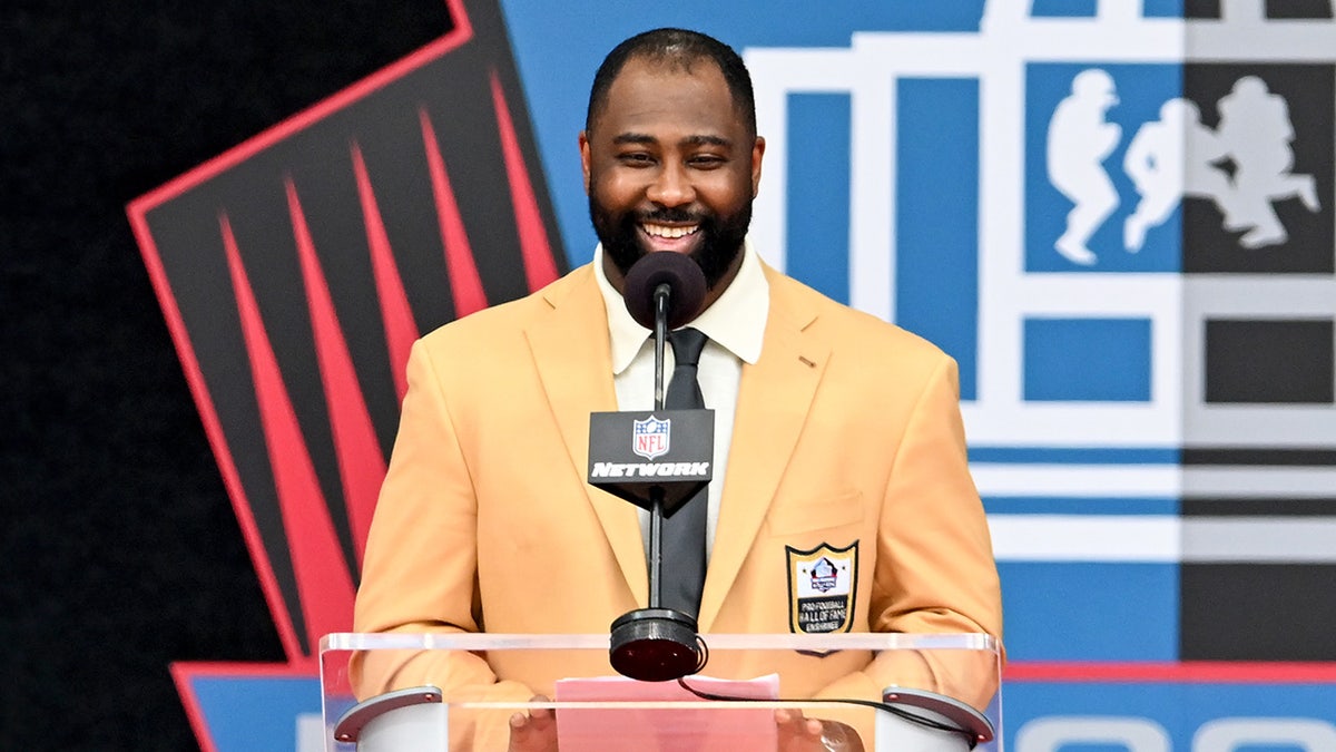 Darrelle Revis smiles at podium