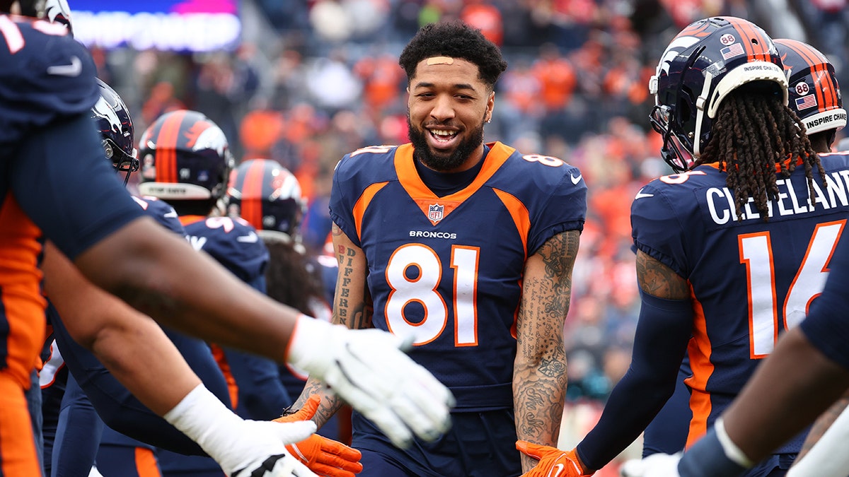 Tim Patrick greeted by Denver Broncos teammates