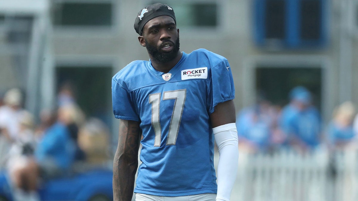 Lions wide receiver Denzel Mims walks off the field