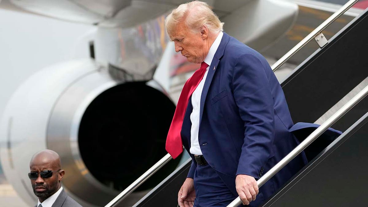 Former President Donald Trump arrives at Ronald Reagan Washington National Airport