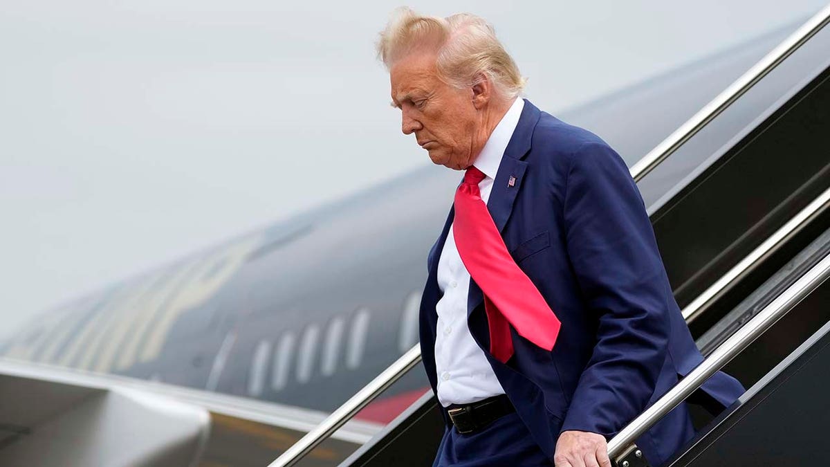 Former President Donald Trump arrives at Ronald Reagan Washington National Airport