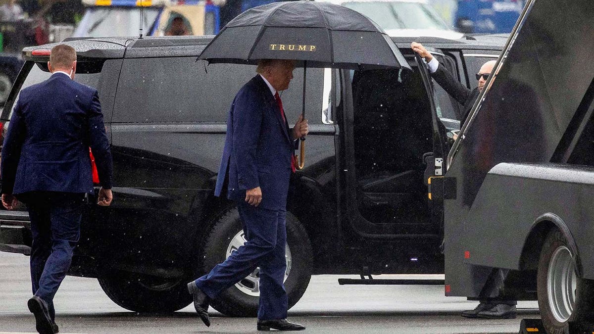 Donald Trump prepares to board his plane and depart Washington D.C.