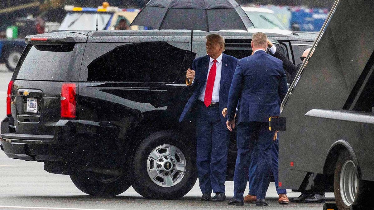 Donald Trump prepares to board his plane and depart Washington D.C.