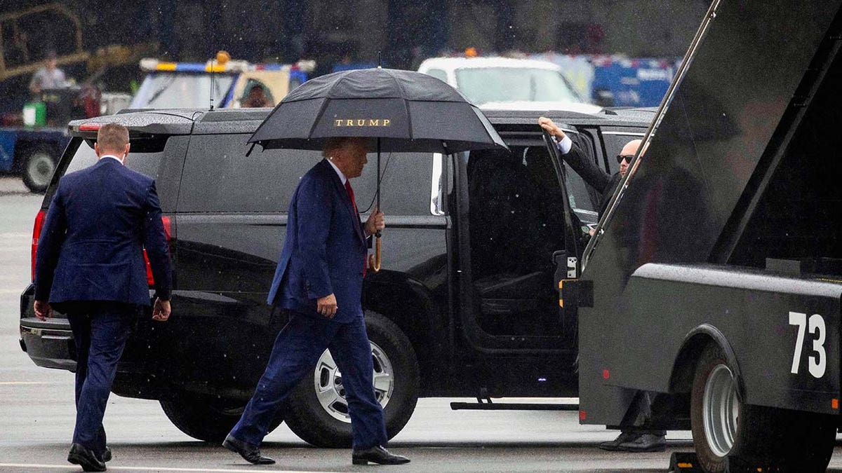 Donald Trump prepares to board his plane and depart Washington D.C.