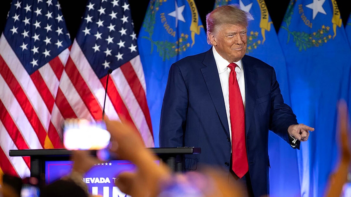 Former President Donald Trump on stage at an event