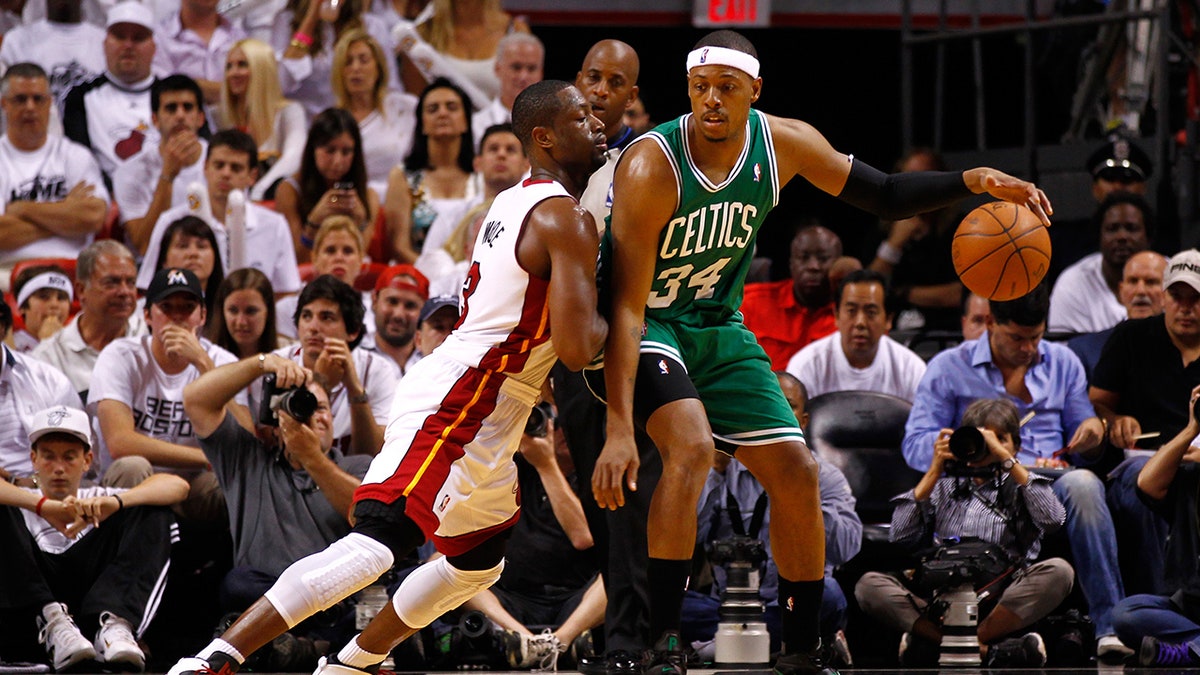 Dwyane Wade and Paul Pierce on the court