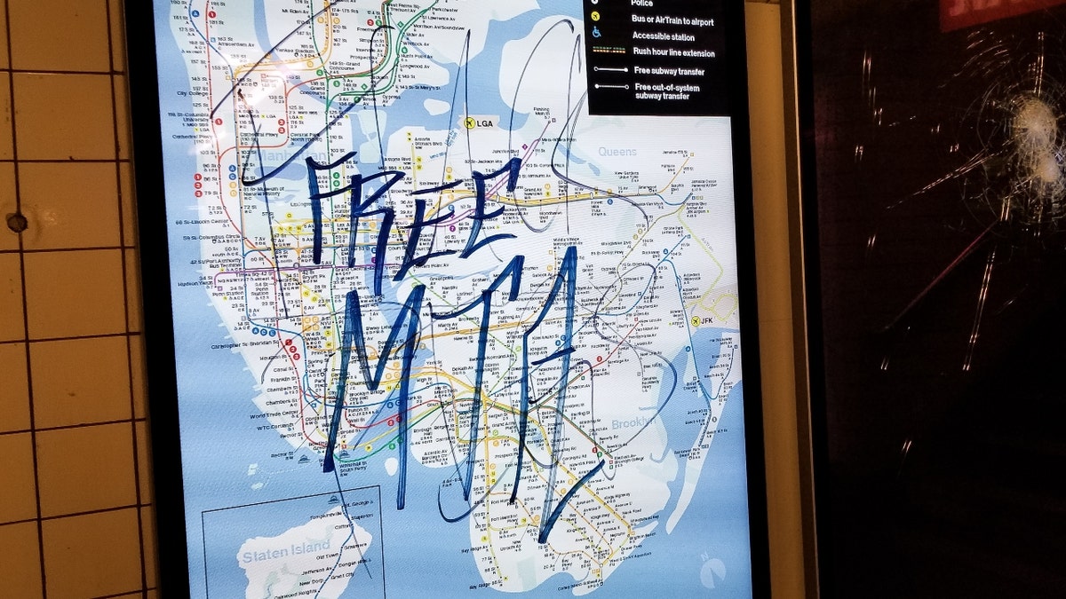 Graffiti on a map of New York City that reads, "Free MTA"