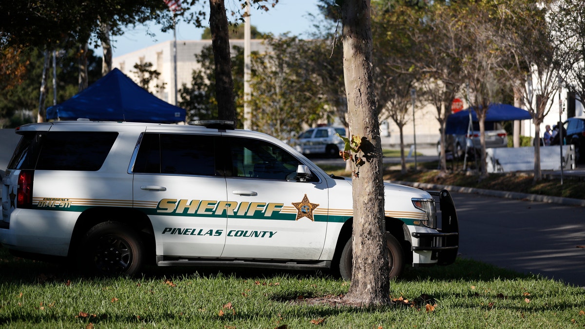 A Pinellas County Sheriff deputy parked along the road.