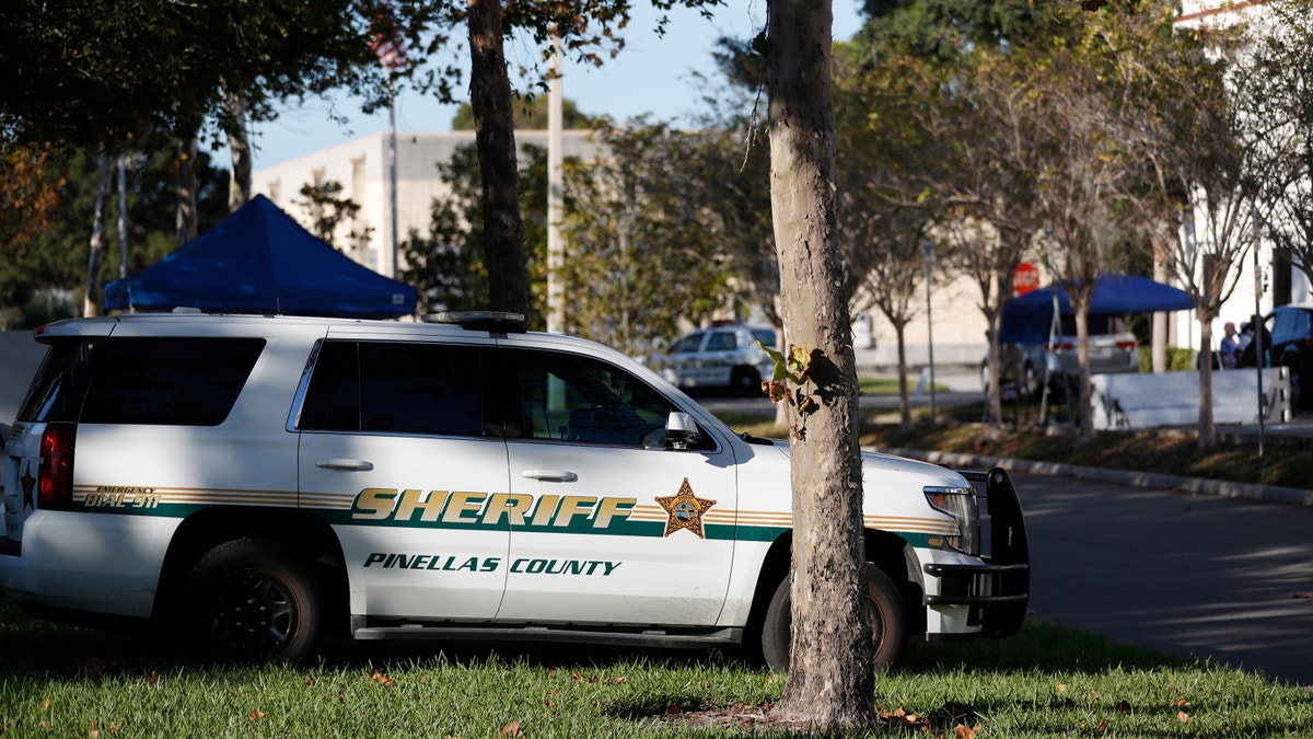 A Pinellas County Sheriff deputy parked along the road.