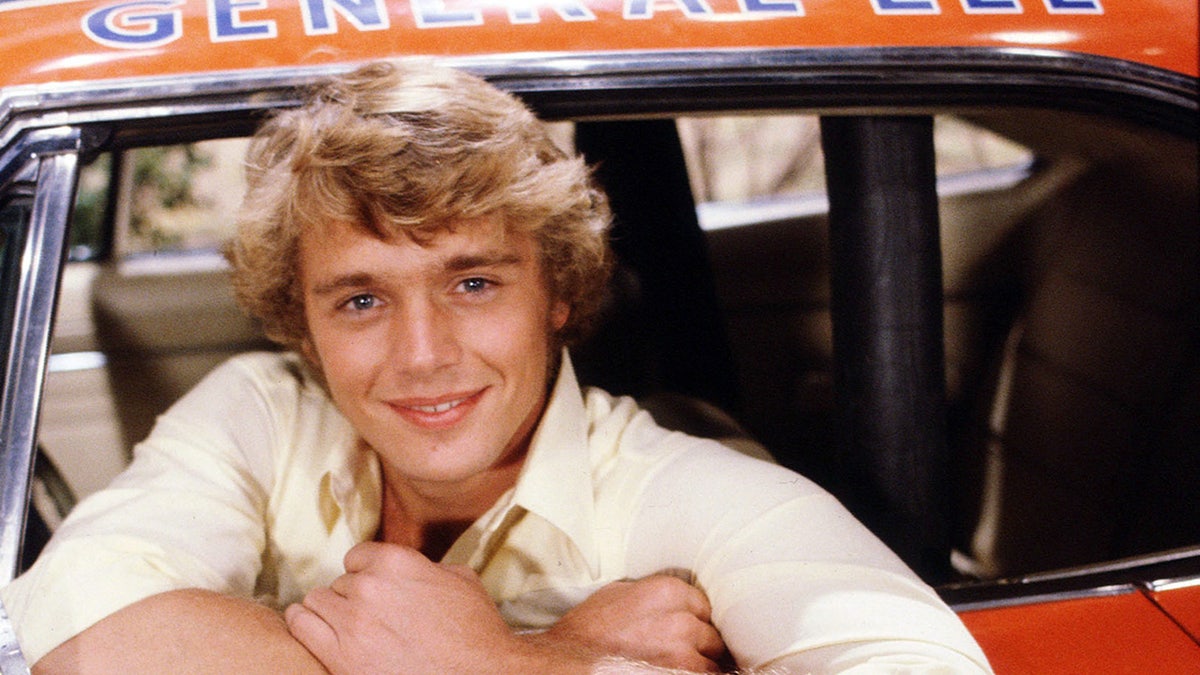 John Schneider as Bo Duke on the Dukes of Hazzard