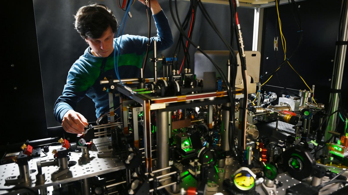 man in a quantum computer lab with equipment