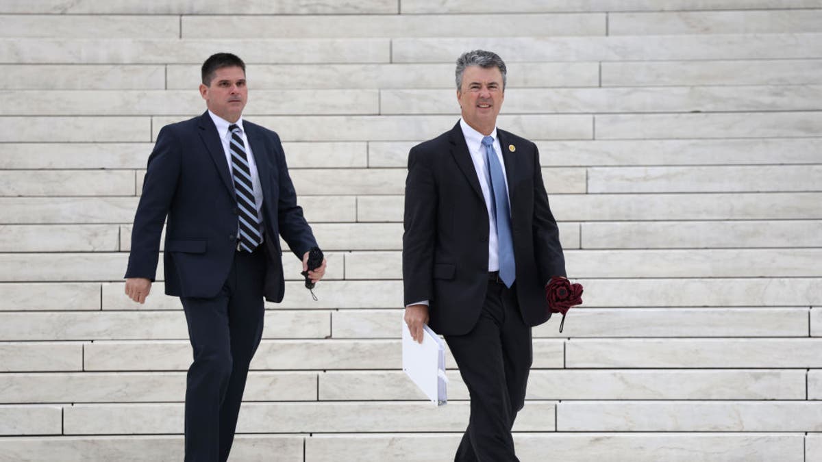 Alabama Attorney General Steve Marshall, right, is calling for an investigation into President Biden reversing his decision to put Space Command headquarters in Huntsville.