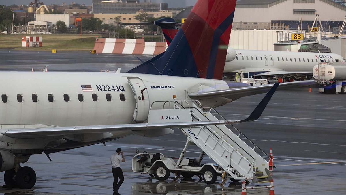 Delta plane wing clips runway during botched landing at LaGuardia Airport  at george magazine