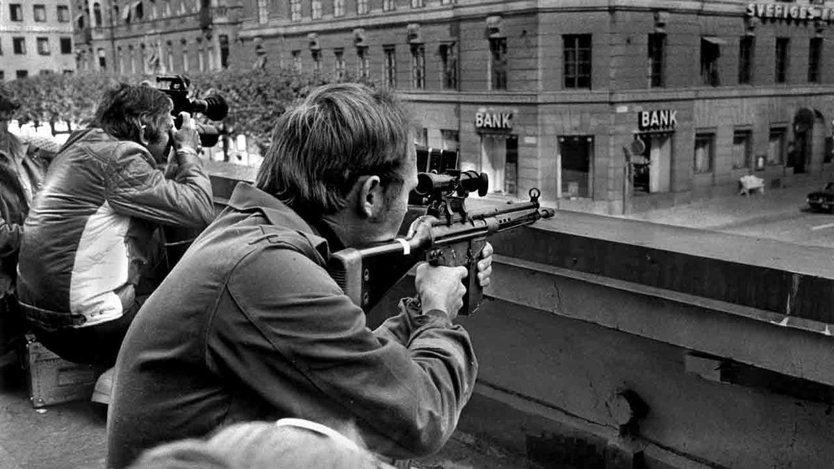 Sniper and photographer outside the bank in Stockholm