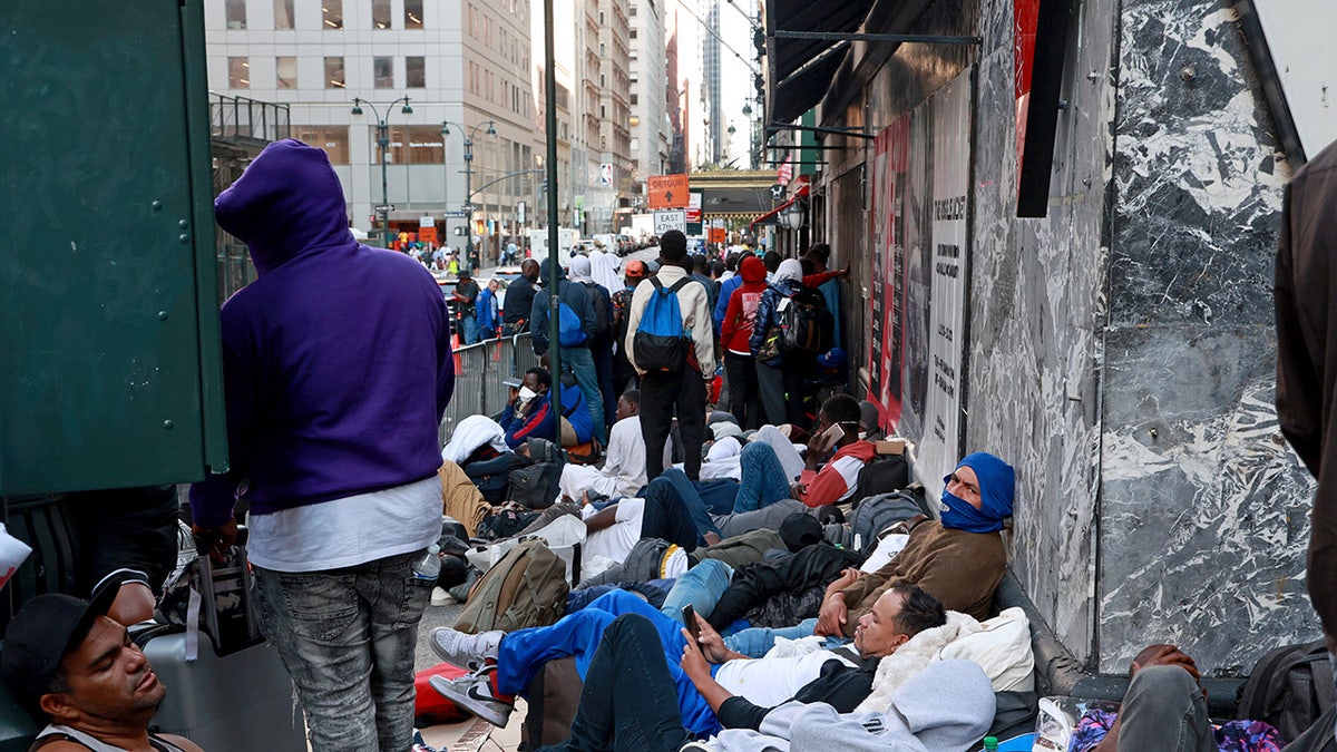 NYC migrants outside Roosevelt Hotel