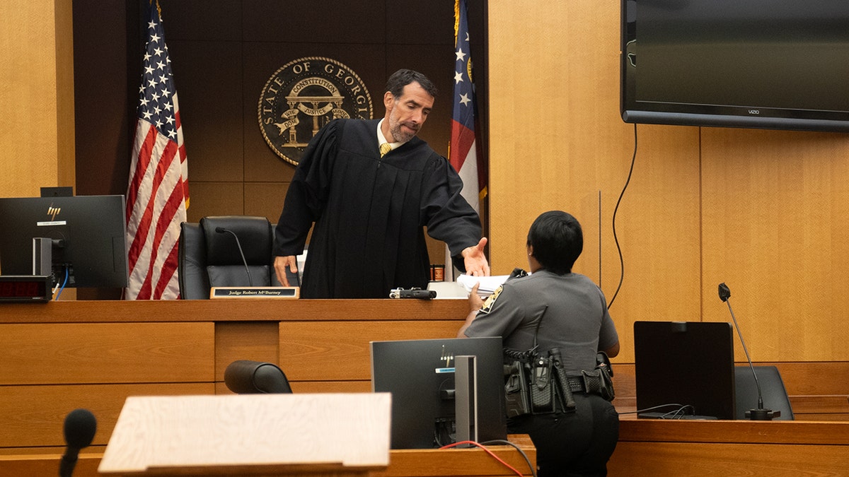ATLANTA, GEORGIA - AUGUST 14: Fulton County Superior Court Judge Robert McBurney receives documents on August 14, 2023 in Atlanta, Georgia. District Attorney Fani Willis has been bringing evidence before a grand jury, which indicted former President Trump on alleged attempts to overturn the 2020 election results in the state.