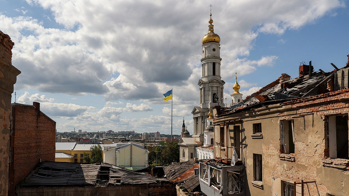 War-tattered town, Ukrainian flag