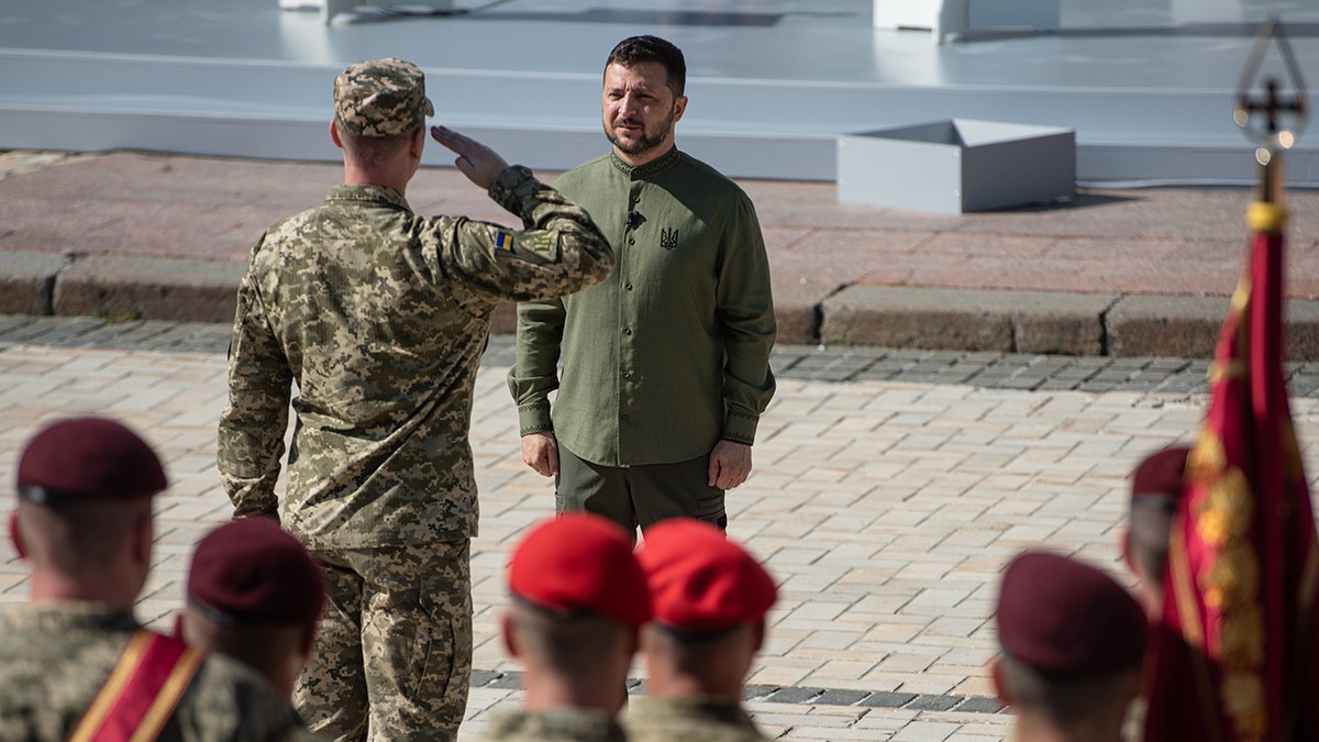 Soldier saluting, Zelenskyy