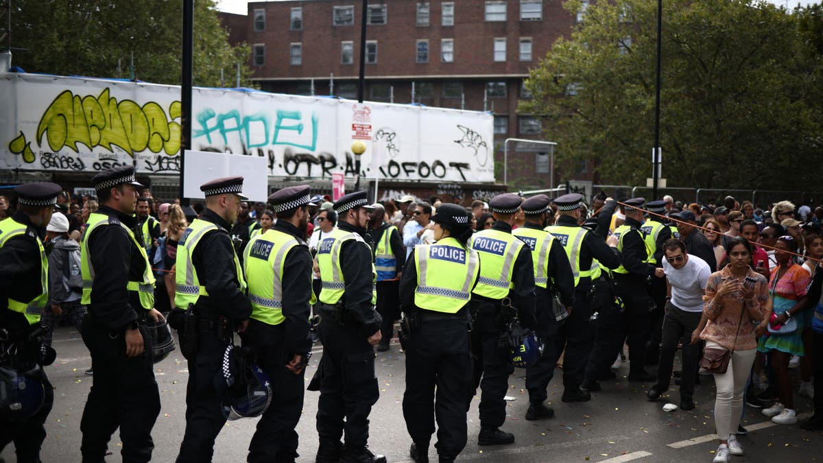 Police officers patrolling the streets during the Notting Hill Carnival in west London