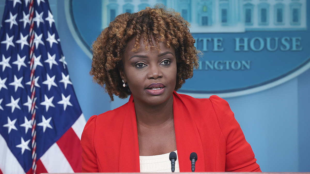 Karine Jean-Pierre in red blazer at podium