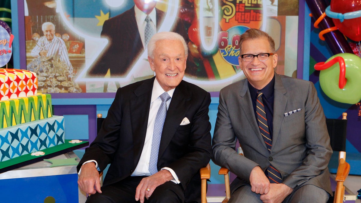Bob Barker sitting with Drew Carey on the Price is Right Set