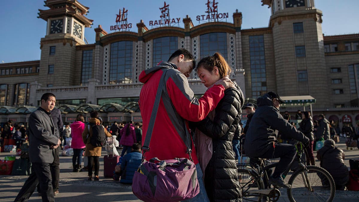 Chinese couple say good byes