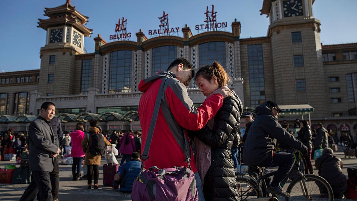 Chinese couple say good byes