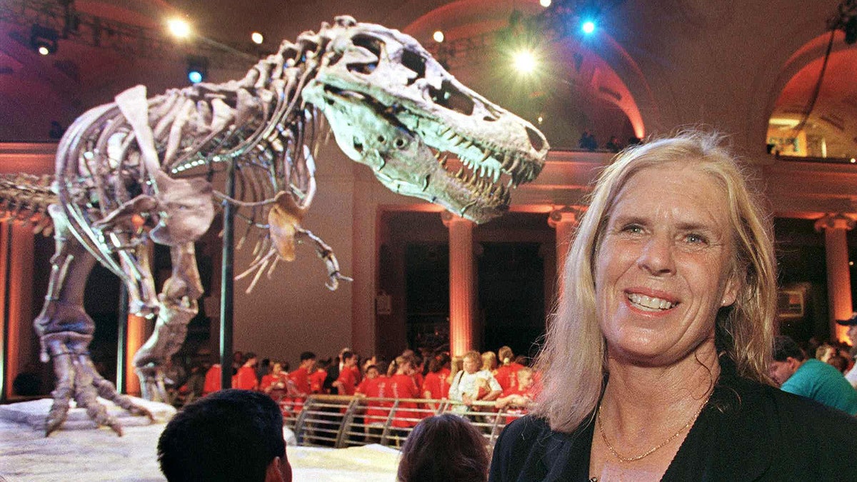 woman standing in front of T-Rex