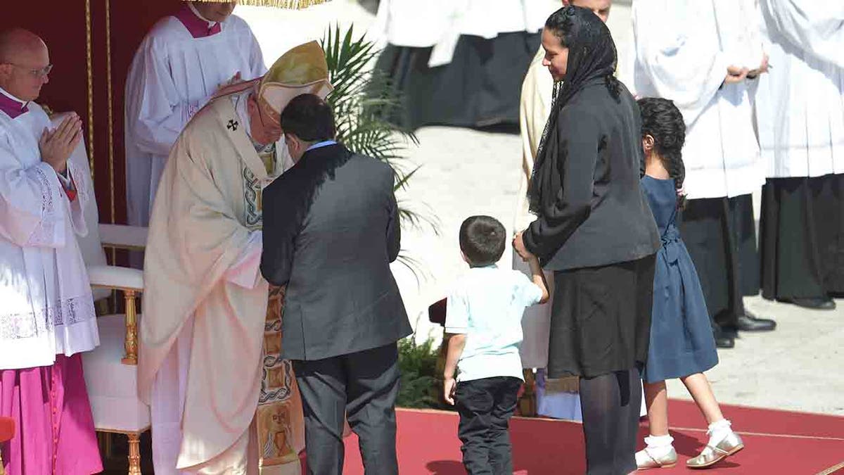 Pope Francis greeting the family of the man who was saved by Mother Teresa's intervention