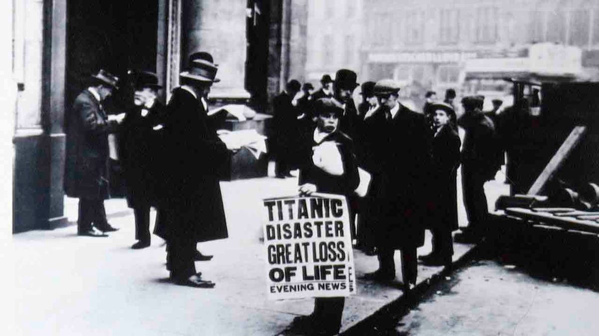Newsboy holding paper saying Titanic Disaster Great Loss of Life