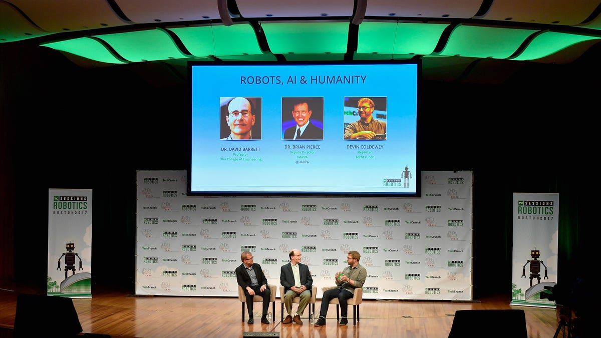 men on stage at robotics event in 2017