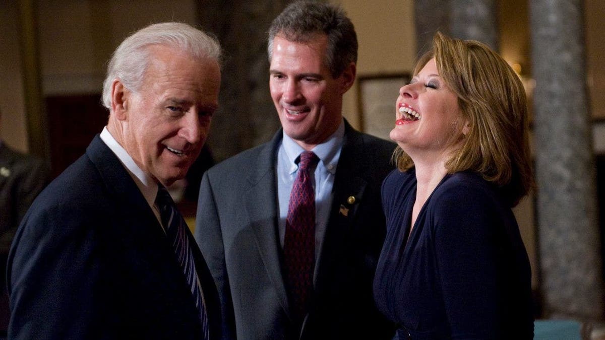 Sen. Scott Brown participates in a ceremonial swearing in with his wife Gail Huff and Vice President Joe Biden