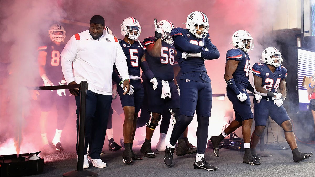 Arizona walks out before a game against Oregon