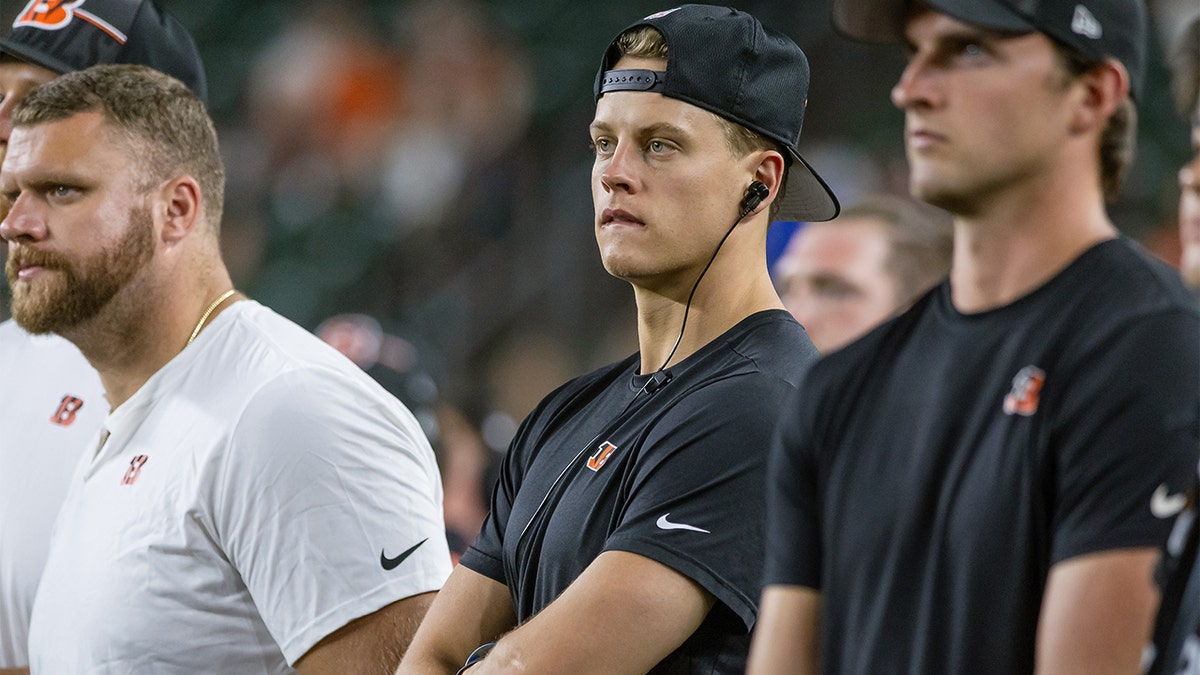 Joe Burrow watches from the sidelines