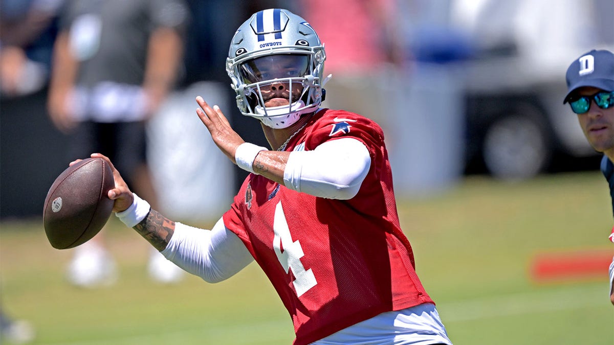 Dak Prescott throws at camp