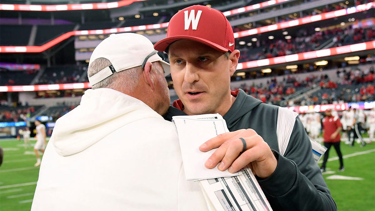 Jake Dickert congratulates the Freson State head coach