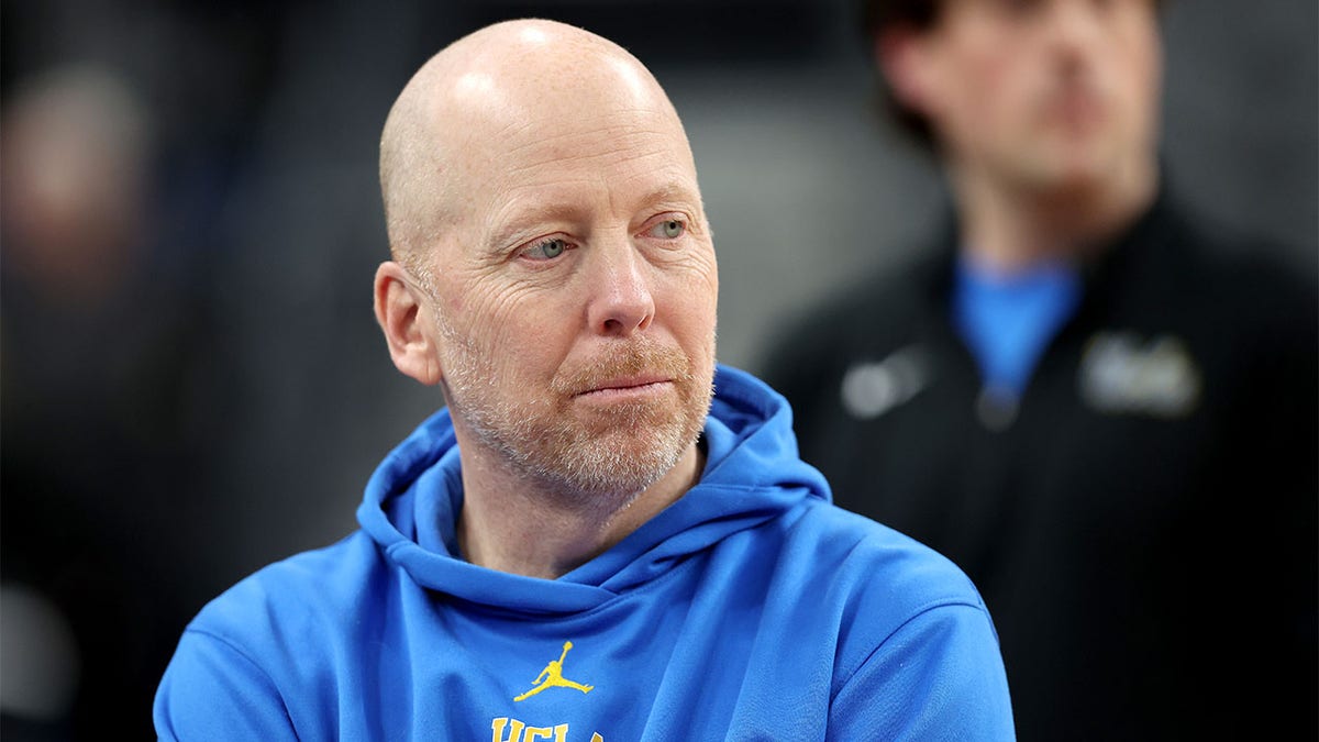 Mick Cronin looks on during practice