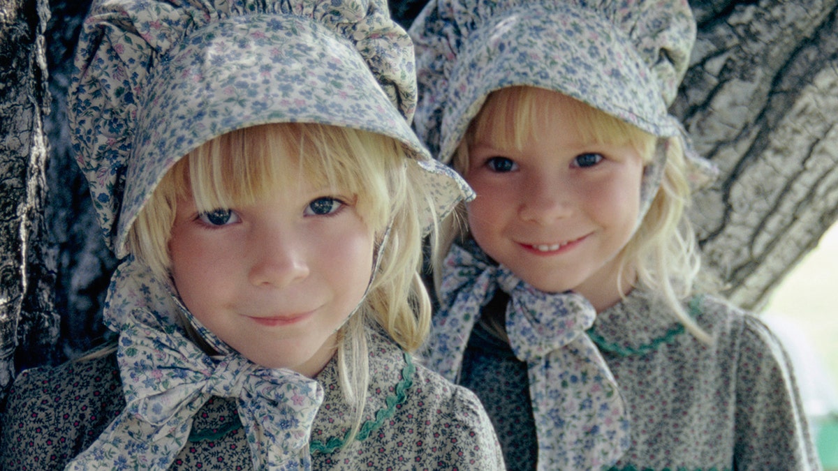 A close-up of Wendi Lou Lee and her twin sister in costume as baby grace ingalls