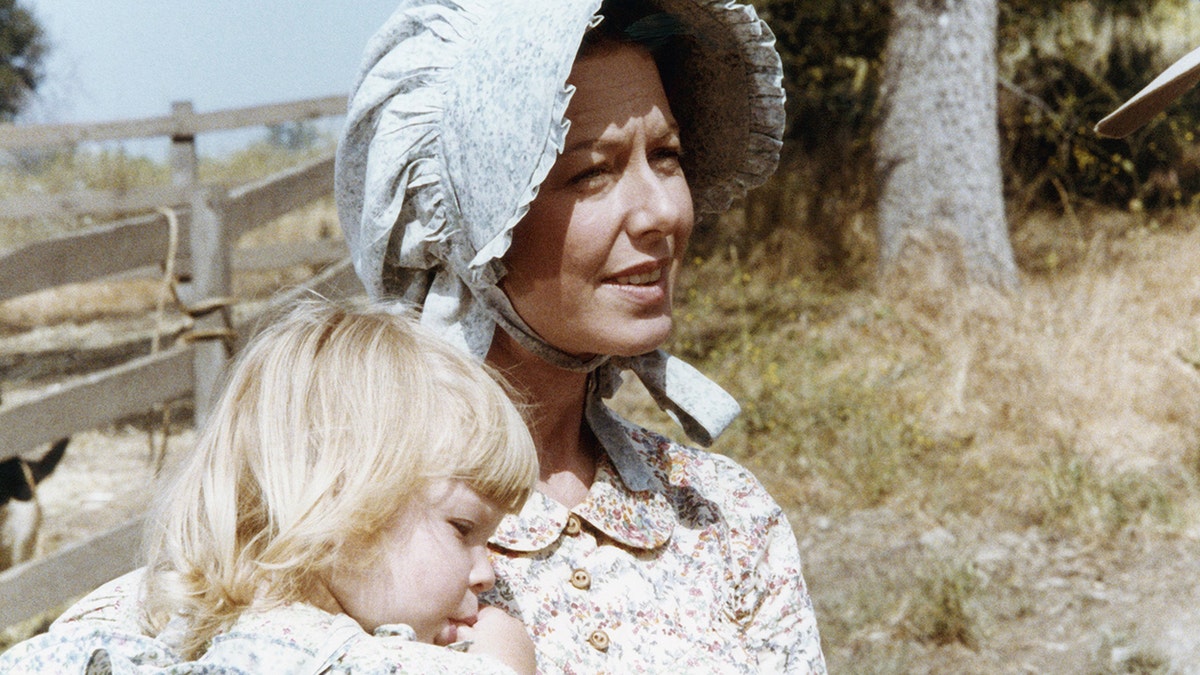 Karen Grassle holding onto either Brenda or Wendi in costume