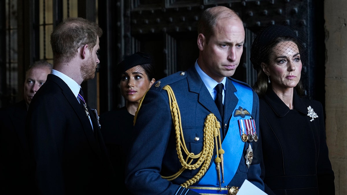 Prince Harry, Meghan Markle, Prince William and Kate Middleton looking somber in the dark