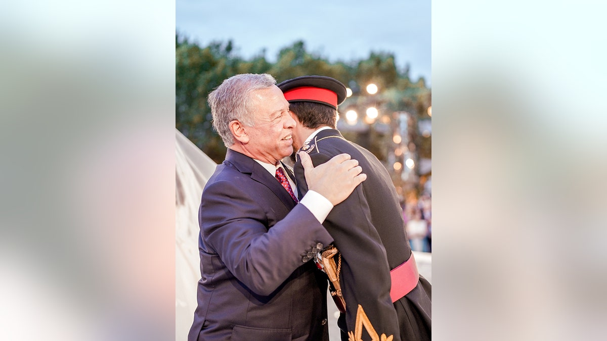 King Abdullah hugging his son Crown Prince Hussein