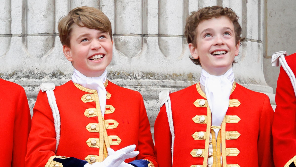 Prince George and Lord Oliver in matching red and gold coats