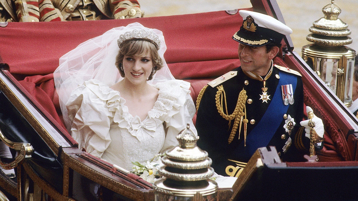 Princess Diana sitting in a coach with Prince Charles on their wedding day