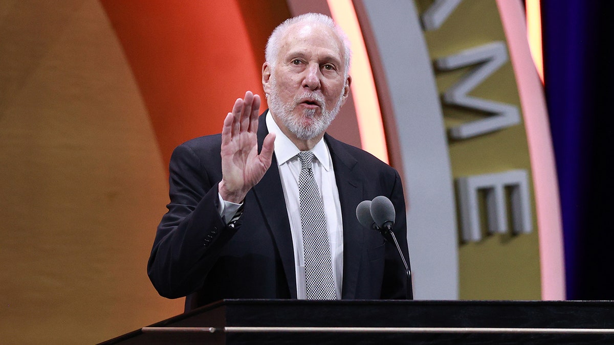 Gregg Popovich talks at podium