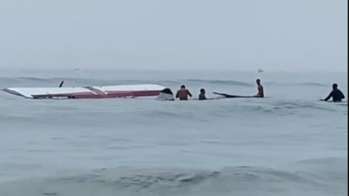 Small plane submerged in water at New Hampshire beach