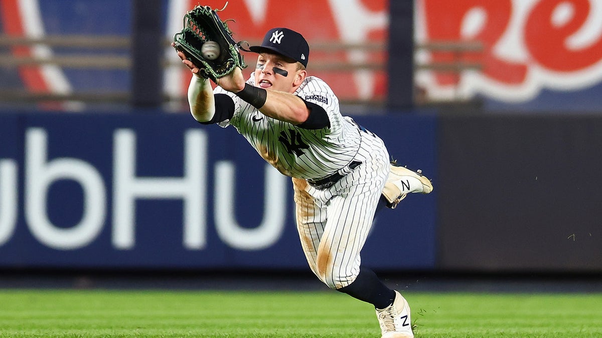 Harrison Bader dives for ball