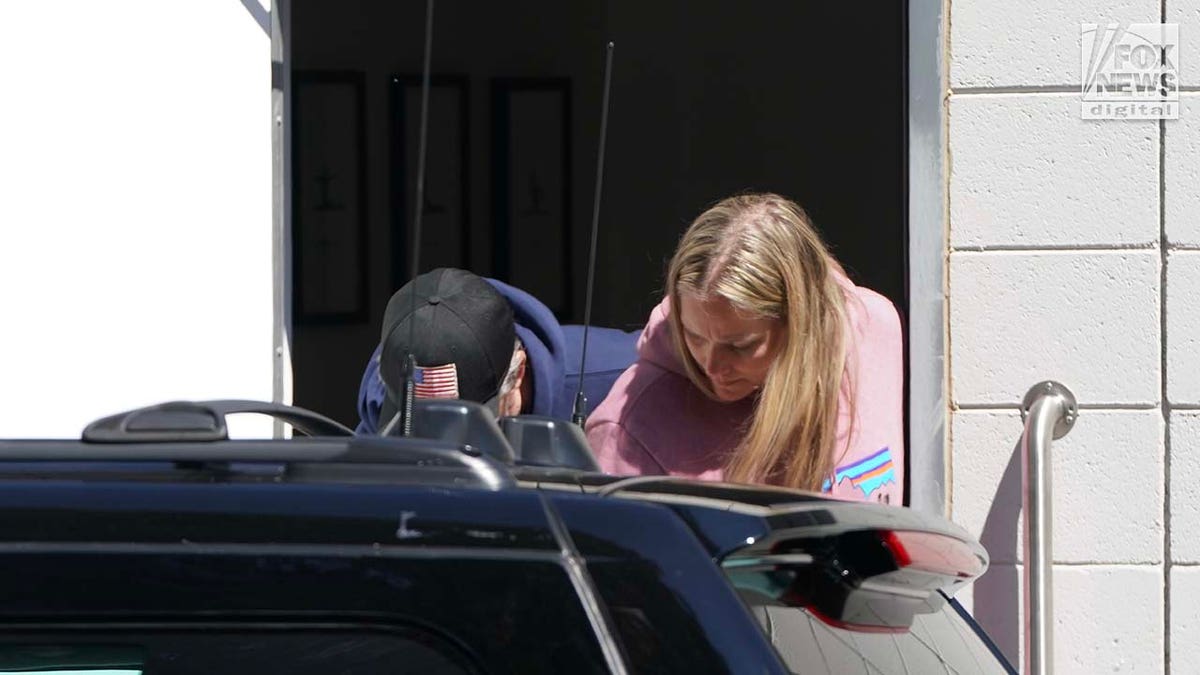 Hunter Biden exits through the back door of a fitness studio