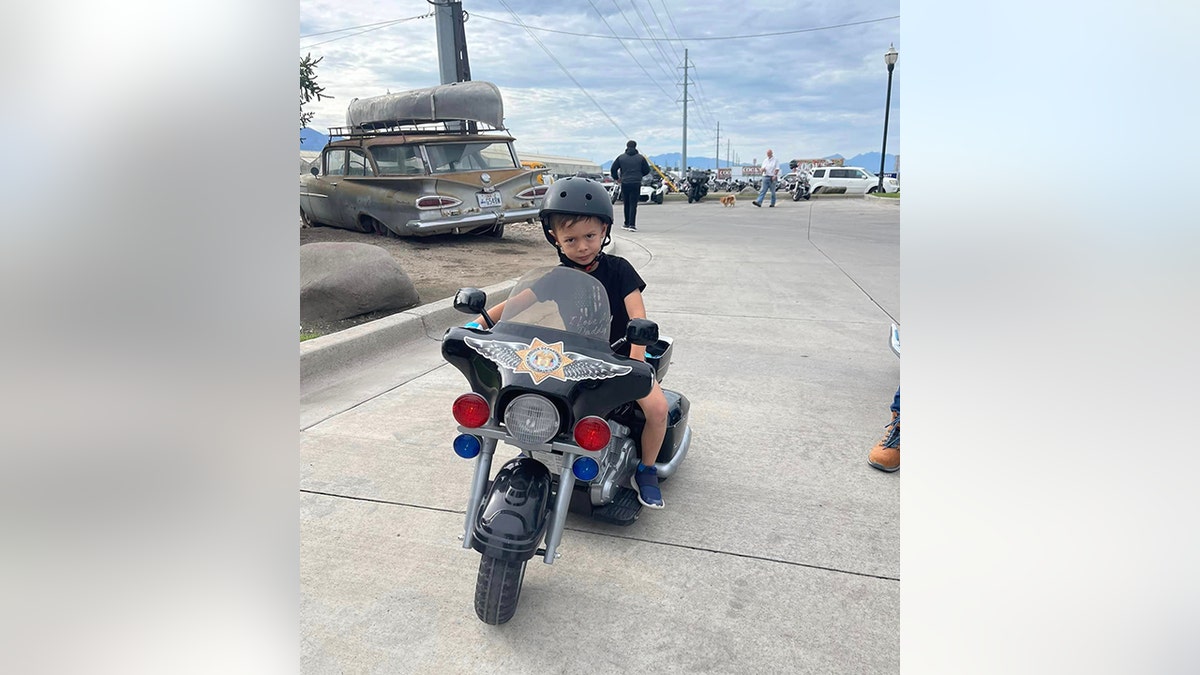 Jackson on toy motorcycle