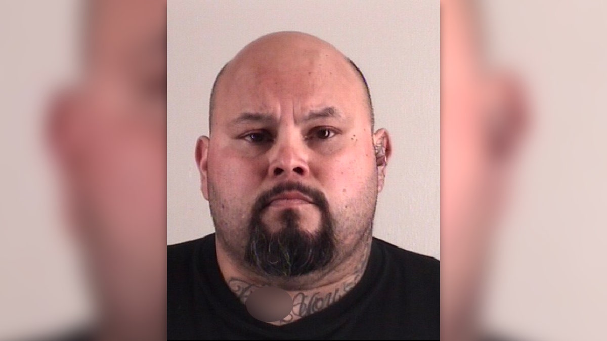 Javier Arredondo has a bald head and goatee in his mug shot